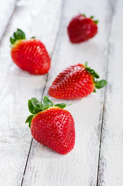 Strawberries on white wooden background — Stock Photo, Image