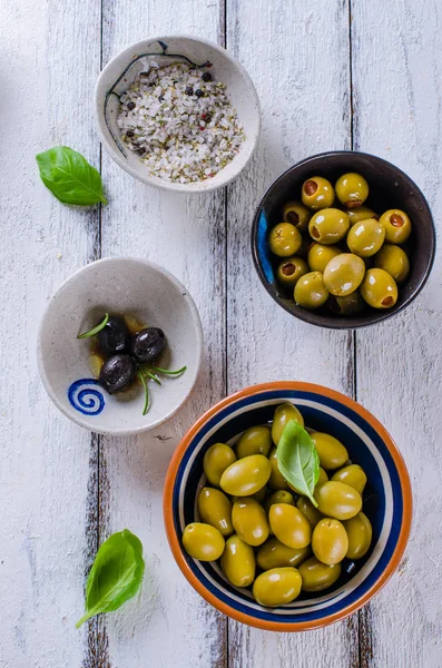 Assortment Olives Herb Sea Salt White Wooden Background — Stock Photo, Image