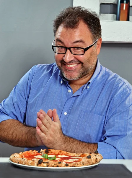 man ready to eat pizza