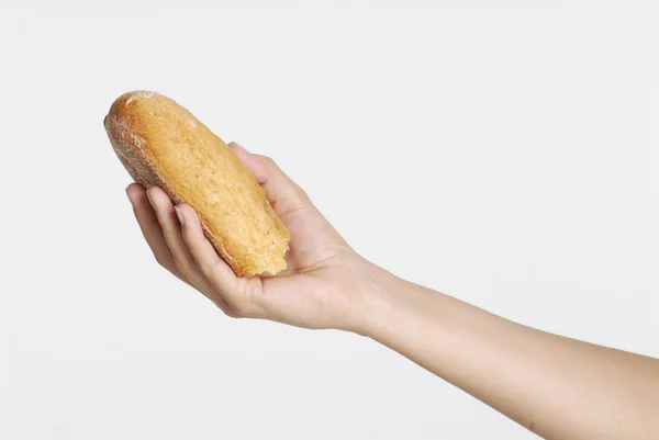 Hand met brood — Stockfoto