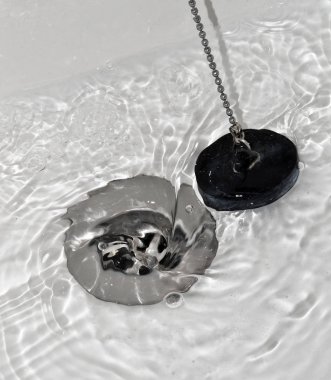 Draining water with the drain rubber plug clipart