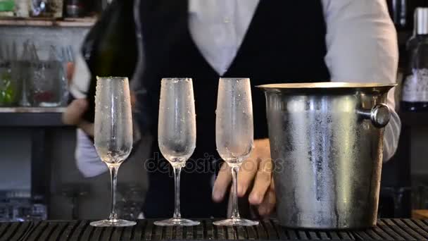 Close Male Hands Pouring Cold Champagne Glasses — Stock Video