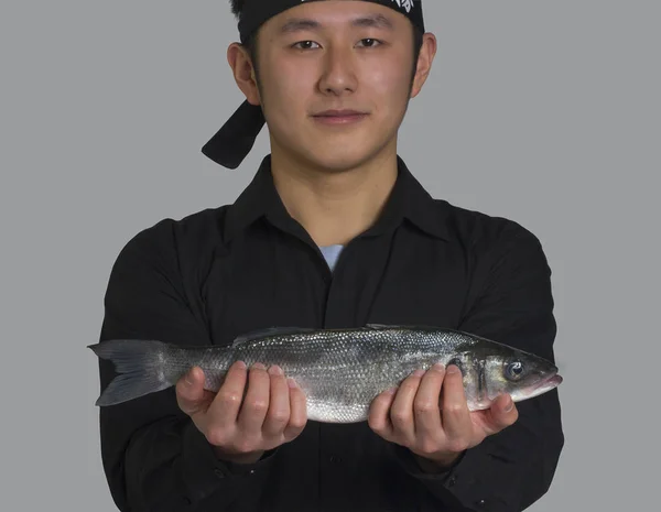 Young Asian Chef Holding Raw Fish — Stock Photo, Image