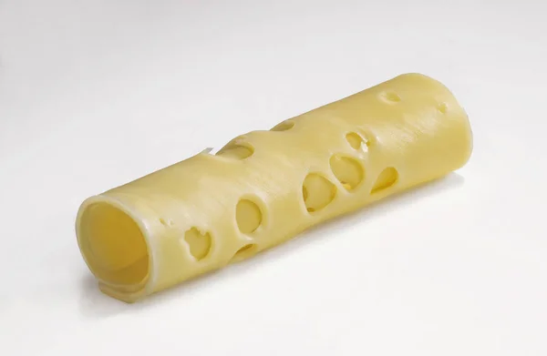 Scheibe Käse Mit Großen Löchern Rohr Gerollt Isoliert Auf Weiß — Stockfoto