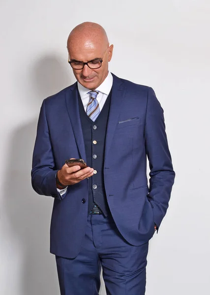 Bald Middle Aged Businessman Using Smartphone Grey Background — Stock Photo, Image