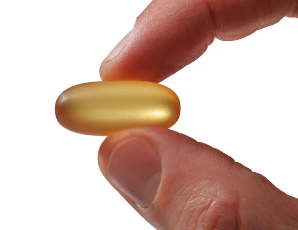 Dedos Seguram Detalhe Amarelo Cápsula Medicamento Transparente Isolado Fundo Branco — Fotografia de Stock