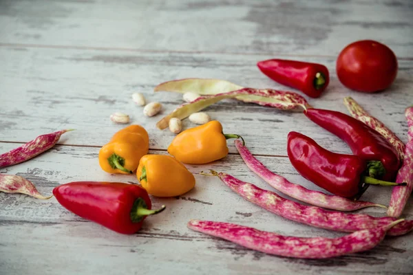 Fresh seasonal vegetables on a gray old table — Stock Photo, Image