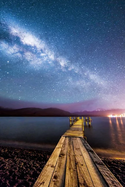 stock image Night milkyway with wooden jetty at Te Anau, New Zealand