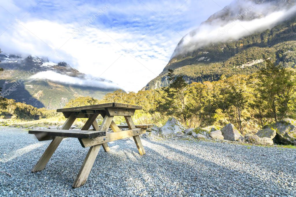 Wooden bench with mountain background