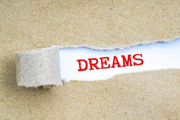 Yırtık kahverengi kağıt arkasında kavramsal metin  