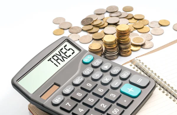 Coins and calculator — Stock Photo, Image