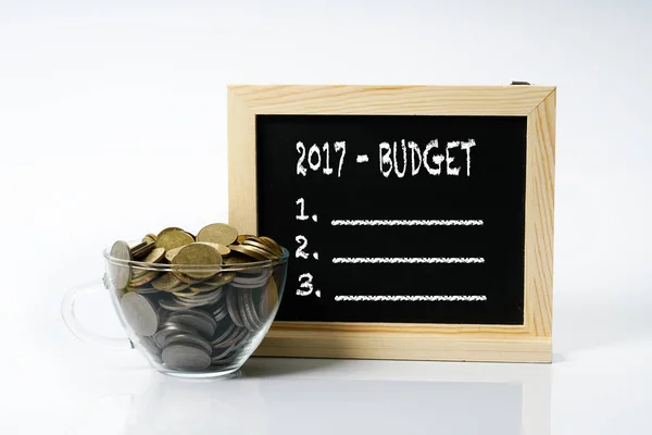 Coins Cup Glass Blackboard White Text New Years Concept — Stock Photo, Image