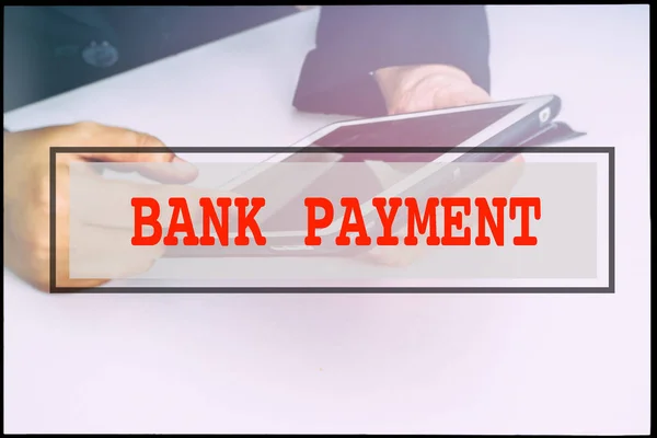 Hand and text BANK PAYMENT with vintage background. Technology concept.