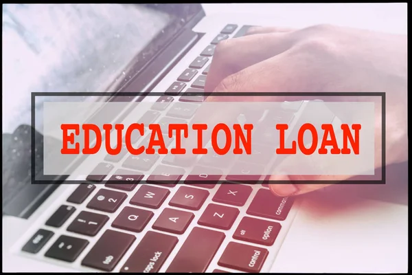 Hand and text  EDUCATION LOAN with vintage background. Technology concept.
