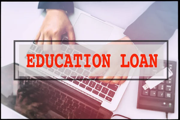 Hand and text  EDUCATION LOAN with vintage background. Technology concept.