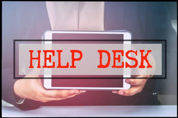 Hand and text HELP DESK with vintage background. Technology concept.