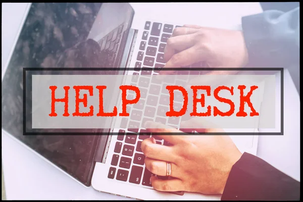 Hand and text HELP DESK with vintage background. Technology concept.