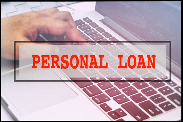 Hand and text  PERSONAL LOAN with vintage background. Technology concept.