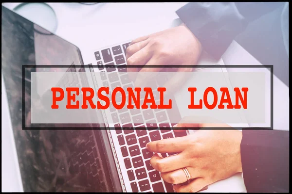 Hand and text  PERSONAL LOAN with vintage background. Technology concept.