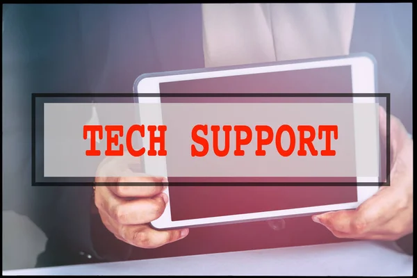 Hand and text TECH SUPPORT with vintage background. Technology concept.