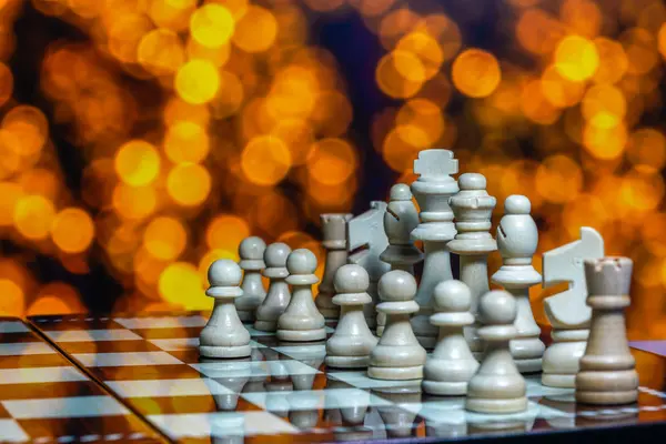 Chess pieces on board with bokeh background — Stock Photo, Image