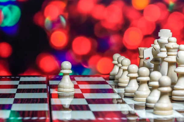 Chess pieces on board with bokeh background — Stock Photo, Image