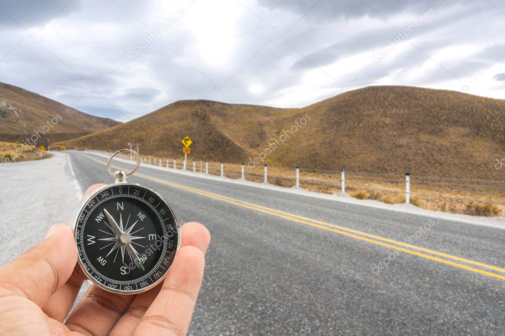 Compass and road background with traveller concept.