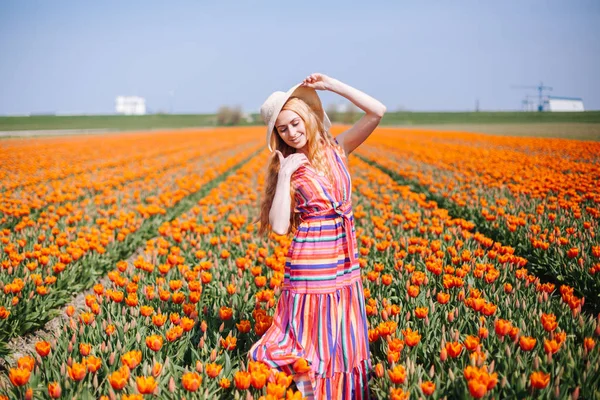 Beautiful young long red hair woman wearing in striped dress and — Stock Photo, Image