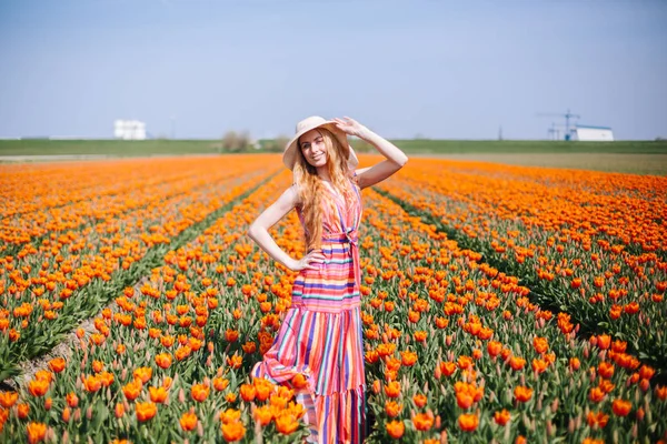 Beautiful young long red hair woman wearing in striped dress and — Stock Photo, Image