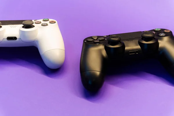 White Black Controllers Purple Background Back View — Stock Photo, Image