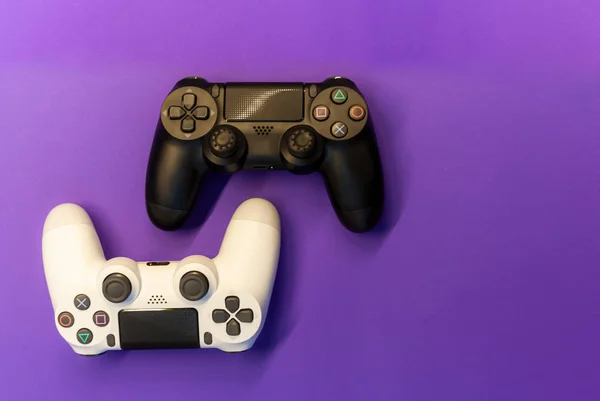 Controllers Purple Background Top View — Stock Photo, Image