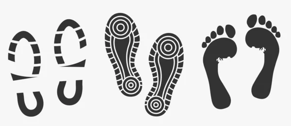 Schwarze einzigartige menschliche Fußabdrücke isoliert auf weiß. Vektor — Stockvektor
