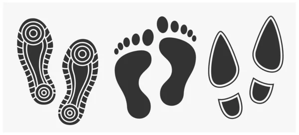在白色上隔离的黑色人类脚印图标. — 图库矢量图片