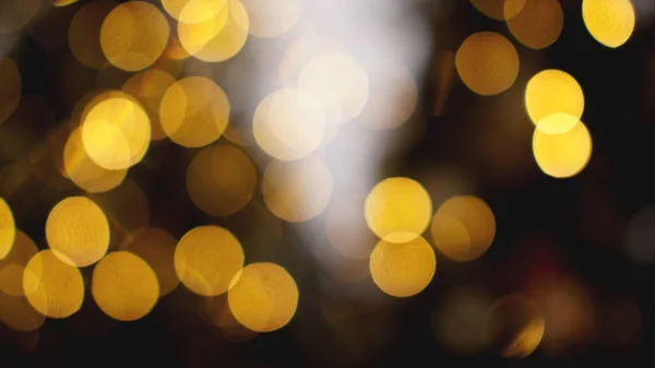 Defocused gold lights on the black background — Stock Photo, Image