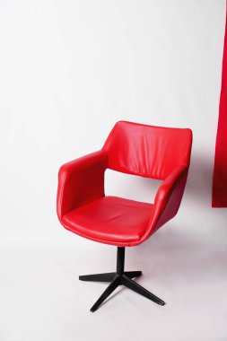 Modern red armchair on a white background in the studio