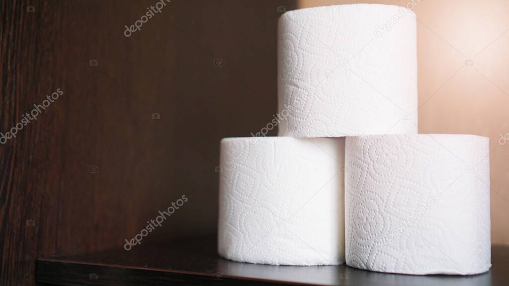 Toilet paper is consider must item during crisis. Tissue rolls - dark background