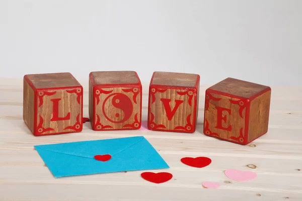 LOVE write in wooden alphabet block on bright board background. Love concept or valentine day — Stock Photo, Image