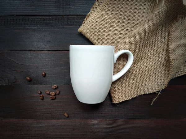 Coffee Mug Mockup on a Brown wooden background. Big White Cup on Brown wooden table