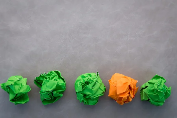 Green and orange crumped paper balls.jpg — стоковое фото