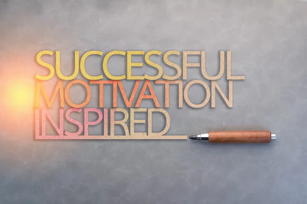 successful motivation inspired  paper text shape with wooden pen