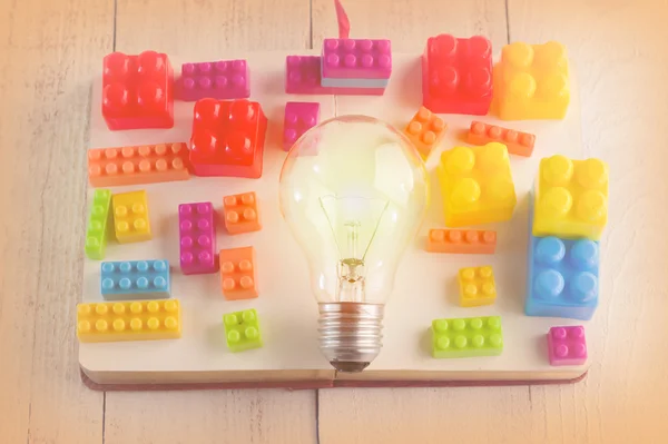 Light bulb with colorful block toys.jpg — Stock Photo, Image