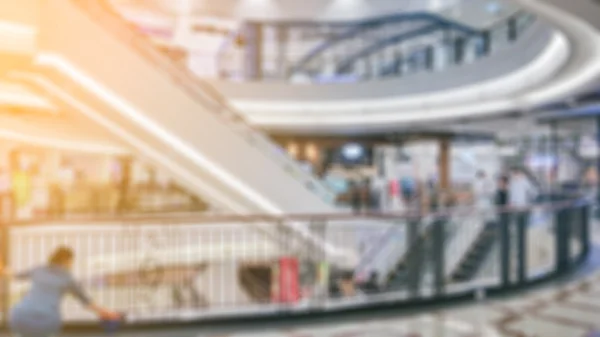 People in motion in escalators at the modern shopping mall. — Stock Photo, Image
