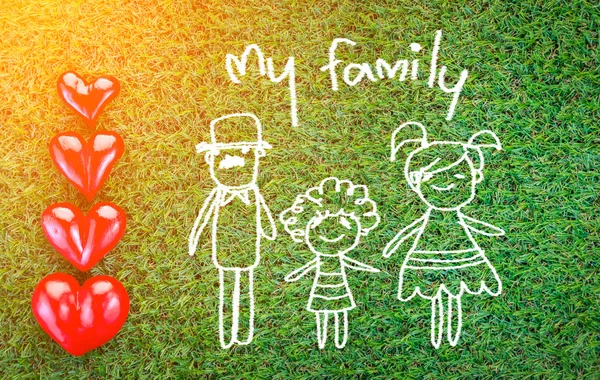 Min familj doodle på grönt gräs fält — Stockfoto