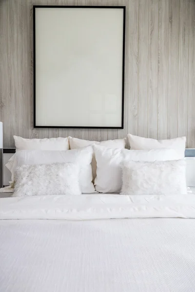 Bed maid-up with clean white pillows and bed sheets