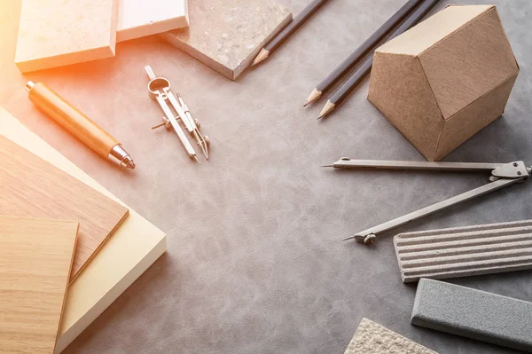 Top view of architects table with stuff of modern house with mat