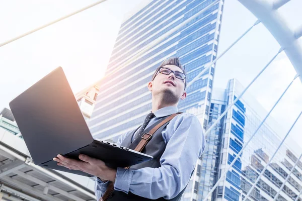 Young Handsome Businessman Standing Laptop Big City Purposefully Looking Away — Stock Photo, Image