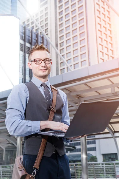 Young Handsome Businessman Standing Laptop Big City Purposefully Looking Away — Stock Photo, Image