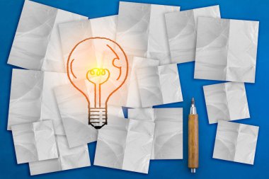 Inspiration concept light bulb idea on white sticky note pads