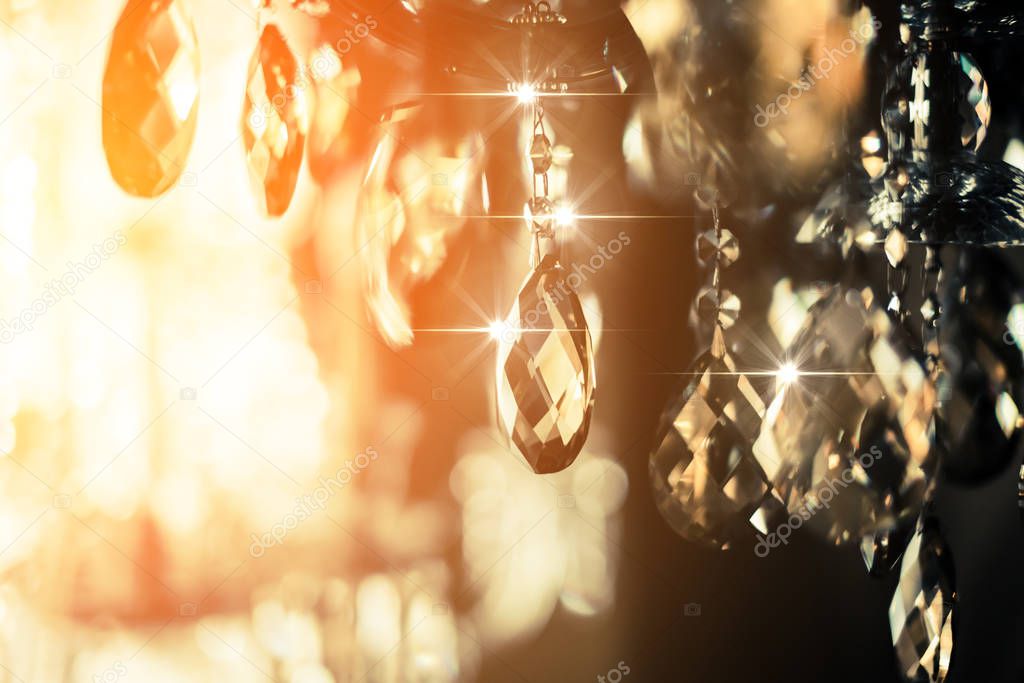 abstract image background of blur bokeh and crystal chandelier light equipment filter tone color effect