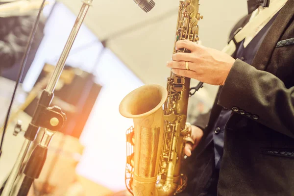 close-up musician lead saxophone keyboard  in live concert musical band